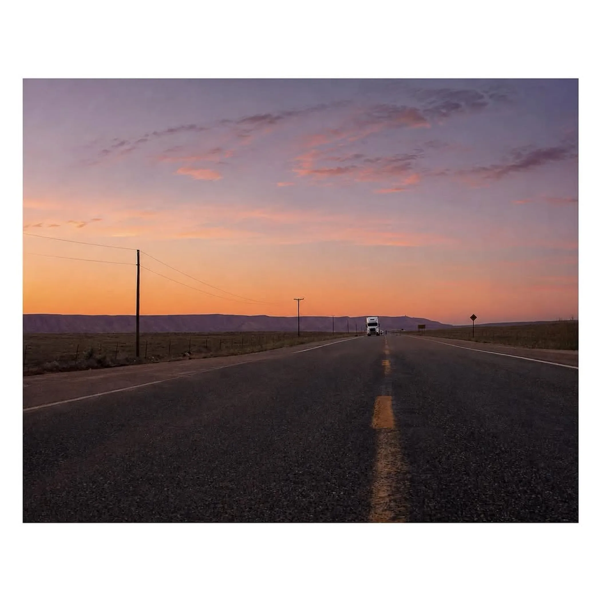 clear desert road with mountains